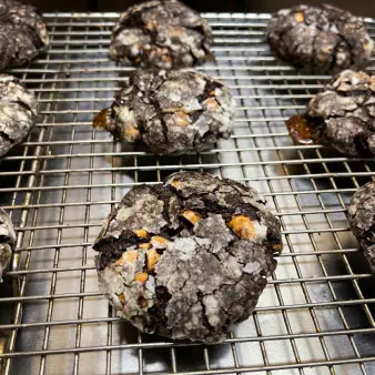 Chocolate cookies cooling on on a wire rack. 